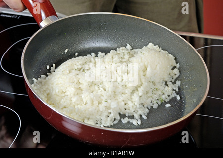 Step 4 Baby squid in ink sauce Stock Photo