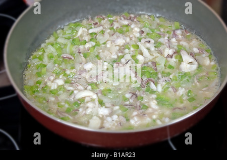 Step 1 Baby squid in ink sauce Stock Photo