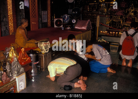 Thai people praying, Wat Phra That Doi Suthep, capital city, Chiang Mai, Chiang Mai Province, Thailand, Southeast Asia, Asia Stock Photo