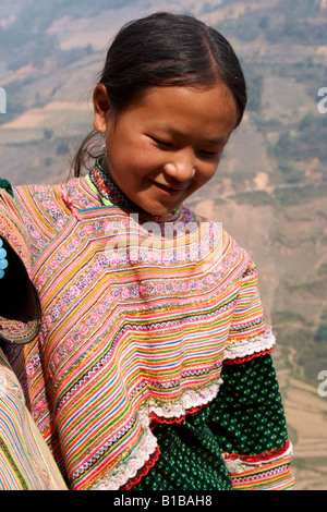 Young woman from The Flower Hmong hill tribe, Bac Ha, Vietnam Stock Photo