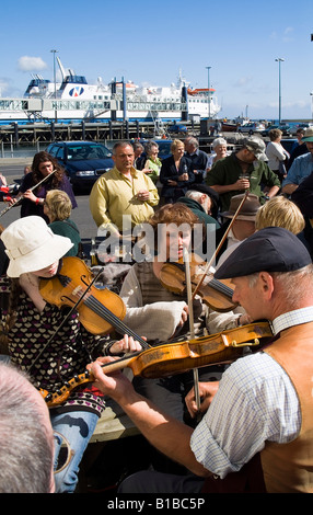 dh Stromness Folk Festival STROMNESS ORKNEY Musicians outside group playing instruments uk scottish band scotland traditional music festivals