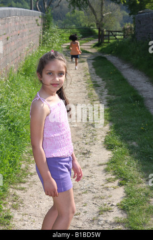 Two young sisters enjoying the English countryside. Stock Photo