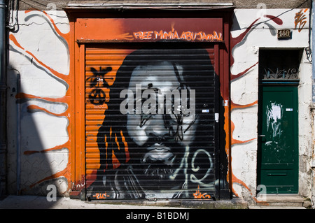 Graffiti mural sprayed onto shop window shutter, Poitiers, Vienne, France. Stock Photo
