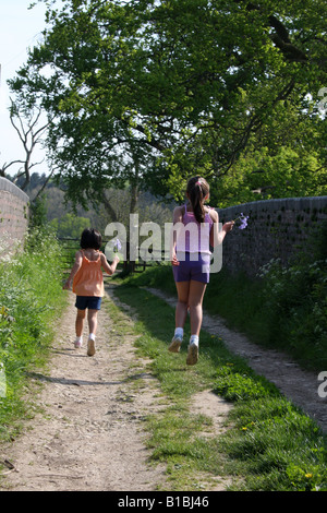 Two young sisters enjoying the English countryside. Stock Photo