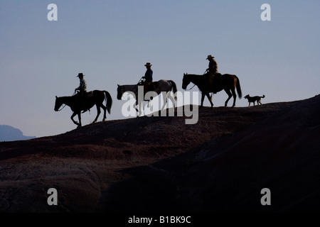 Three Riders on a Ridgetop, Wyoming Stock Photo
