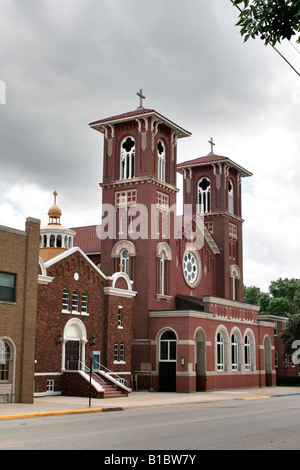 Sacred Heart church next to the Hellenic Orthodox church in Waterloo Iowa Distinctive architecture Stock Photo