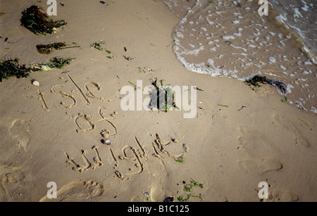 isle of wight written in the sand on a beach Stock Photo