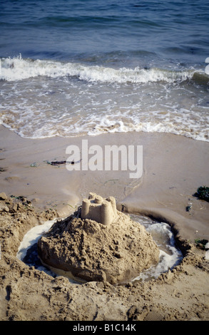 a sandcastle and moat on the beach, Isle of Wight, UK Stock Photo