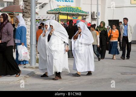 Tripoli, Libya, North Africa. Older Libyan Women wearing Traditional Furashiyas, a Light White Outer Garment. Stock Photo