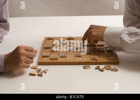 Two young men playing Japanese chess Stock Photo