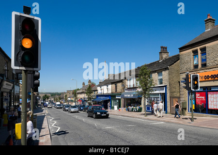 Pedestrian crossing and shops on the High Street in the town centre, Glossop, Peak District, Derbyshire, England, United Kingdom Stock Photo
