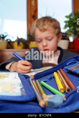 schoolboy doing homework Stock Photo