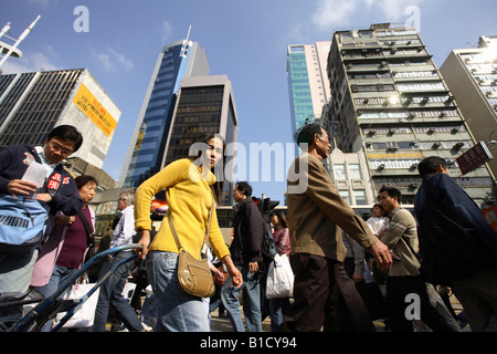 People crossing a street in Kowloon district, Hong Kong, China Stock Photo