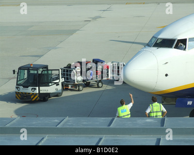 passenger luggage being transported at airport Stock Photo