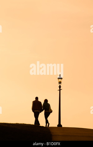 Walking at sunset on Primrose Hill, London Stock Photo