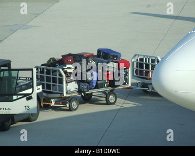 passenger luggage being transported at airport Stock Photo