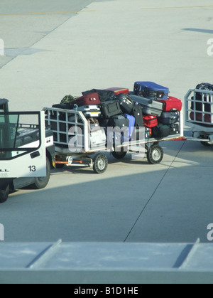 passenger luggage being transported at airport Stock Photo