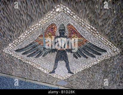 Stone mosaic depiction of Saint Michael, dated 2000, at entrance gate. Church of Saint Michael, Whittington, Lancashire, England Stock Photo