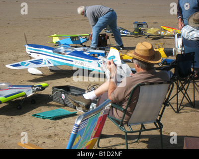 Model aircraft enthusiasts on beach at Brean Somerset during a week long flying meeting Stock Photo