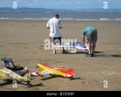 Model aircraft enthusiasts flying on the beach at Brean Somerset Stock Photo