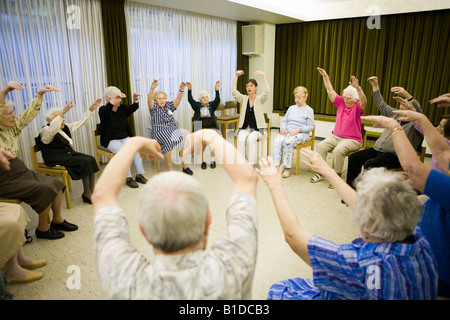 A group of old women during physical therapy in a nursery home, Mainz, Germany Stock Photo