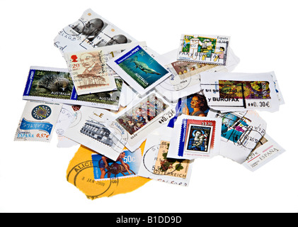 Mixture of franked used international postage stamps from variety of countries Stock Photo