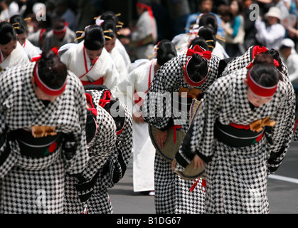 A group of Japanese women in traditional costumes bowing at the 17th Yosakoi Soran Dance Festival. Sapporo, Japan. Stock Photo