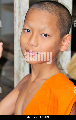 A young novice posing for a nice photo in a Buddhist temple. Sangkhla Buri, Thailand. Stock Photo