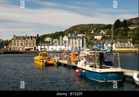 Fishing boats tied up in the harbour of Tarbert, Loch Fyne, Scotland an idyllic fishing village popular with tourists. Stock Photo