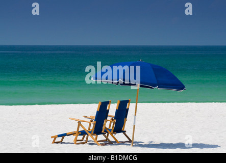 chairs and umbrella on beach Stock Photo