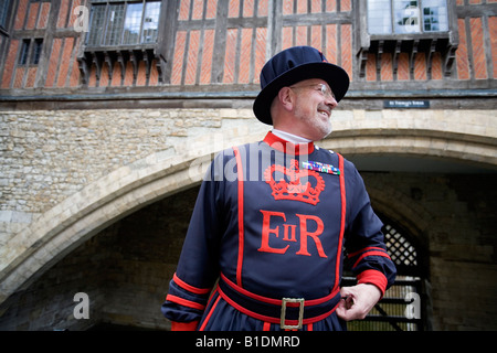 Traditional Beefeater Yeoman of the Guard warder at the 'traitor gate' 'Tower of London' England Britain UK Stock Photo