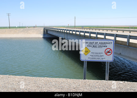 Warning sign at the Quail road bridge over the California aqueduct near Kettleman City central valley of California Stock Photo