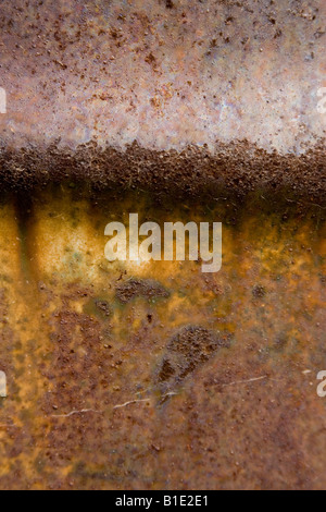 Golden orange metallic background with dark rust from age showing through Stock Photo