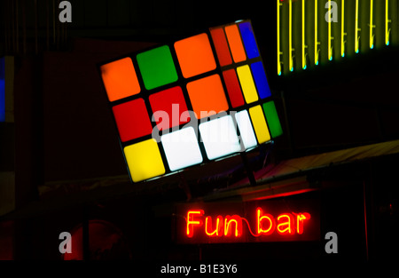 Night time FUN BAR on main street in Malia on the Greek Mediterranean island of Crete Stock Photo