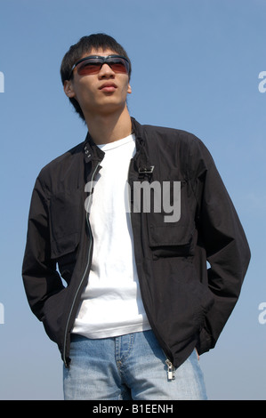 Young Asian man in sunglasses Stock Photo