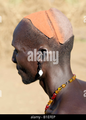 A fine clay hairstyle of a Dassanech man before it is decorated with natural pigments. Stock Photo