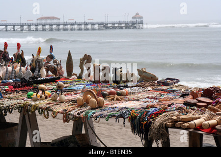 Handmade jewellery and crafts laid out from a street vendor on the beachfront boulevard at Huanchaco beach near Trujillo, Peru. Stock Photo