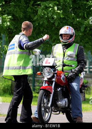 A comical moment where it appears as though the cbt instructor is going to hit the trainee Stock Photo