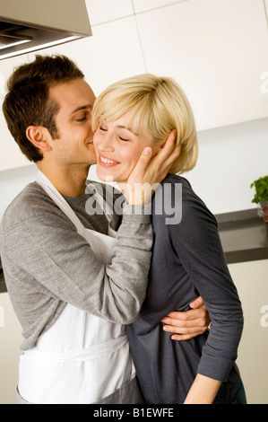Side profile of a young man kissing a young woman's hand Stock Photo ...