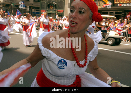 A dancer wears a Barack Obama sticker in the 13th Annual National Puerto Rican Day Parade in New York on Fifth Avenue Stock Photo