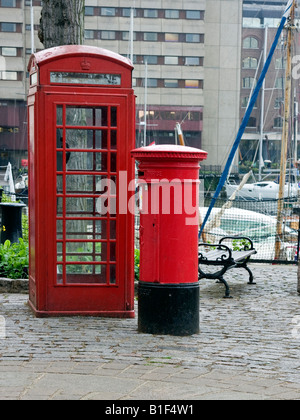 Traditional Red Phone Booth and Postal Box at St Katharine Docks in London England Stock Photo