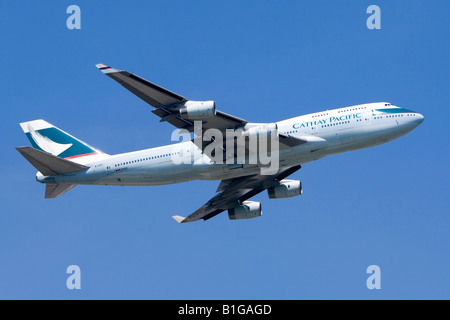 Boeing 747 operated by Cathay Pacific climbing out from London Heathrow Airport. Stock Photo