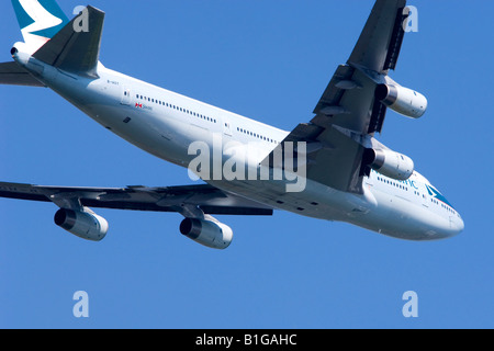 Boeing 747 operated by Cathay Pacific climbing out from London Heathrow Airport. Stock Photo