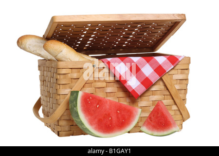 Picnic basket with watermelon and bread cutout on white background Stock Photo