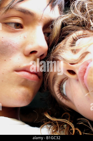 Close-up faces of young couple looking at each other Stock Photo
