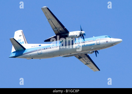 Fokker 50 operated by KlM climbing out from London Heathrow Airport. Stock Photo