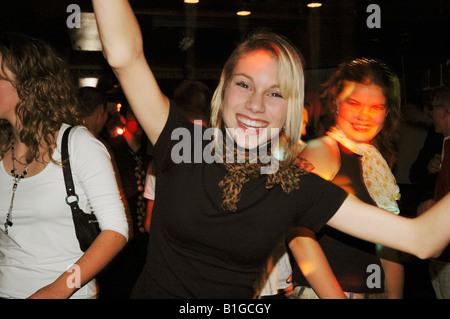 teenage girl posing for camera on night out