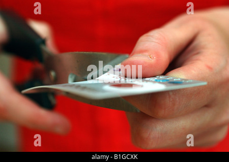 A credit card is cut in two. Stock Photo