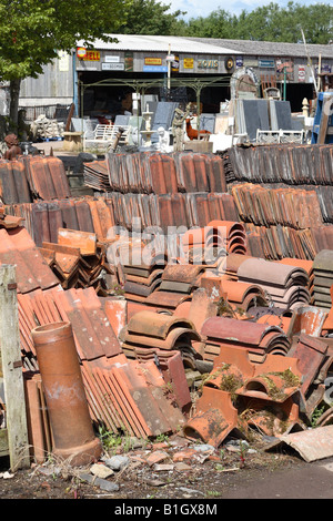 Old red roof tile and slate for sale at a Reclamation yard building material salvage centre in Wells Somerset England Stock Photo