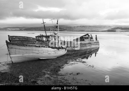 Wrecked boats on a Scottish Loch Scotland uk Stock Photo